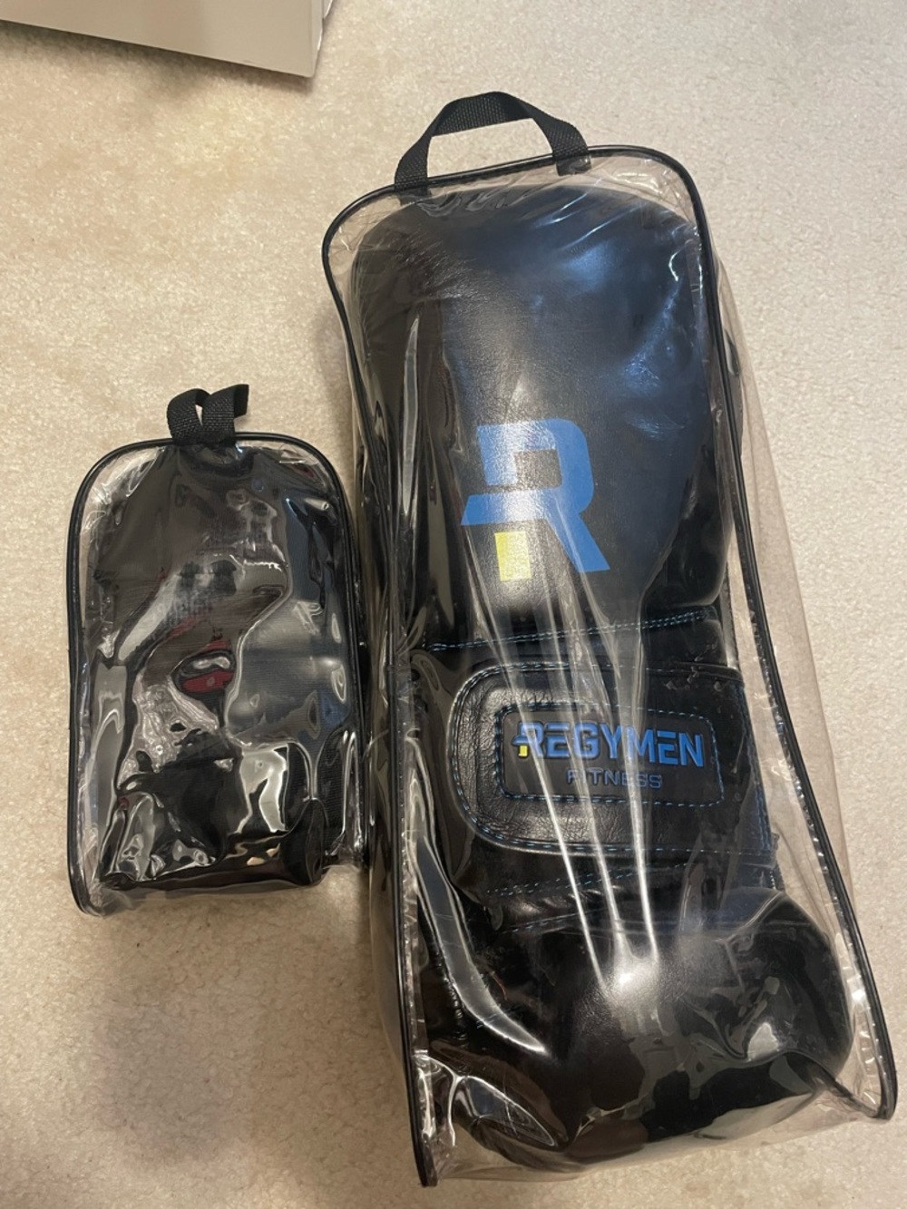 Black boxing gloves and gel wraps Clear Carry Case